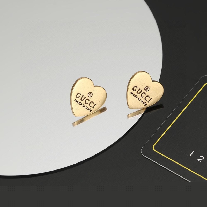 G*u*i earrings